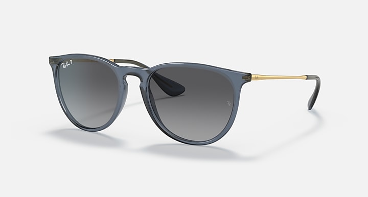 Dark gray sunglasses with dark gradient lenses and gold-tone temple hardware
