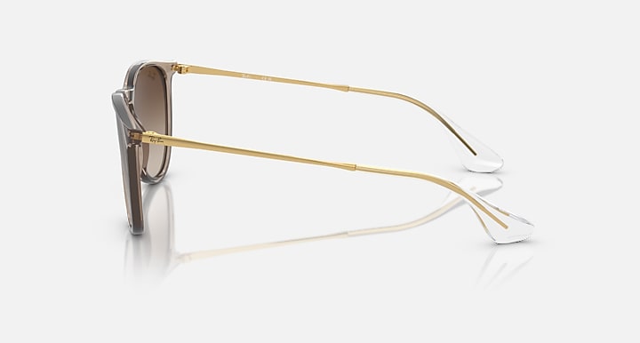 Brown gradient sunglasses with gold metal frame, side profile view