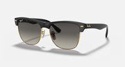 Oversized black browline sunglasses with dark lenses and gold-tone accents, large fit