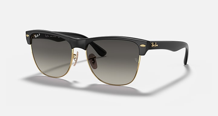 Oversized black browline sunglasses with dark lenses and gold-tone accents, large fit