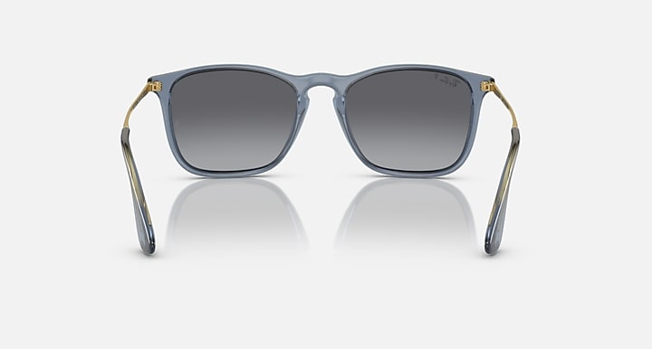 Square sunglasses with smoky gray lenses, light blue frame, and gold-tone temple tips