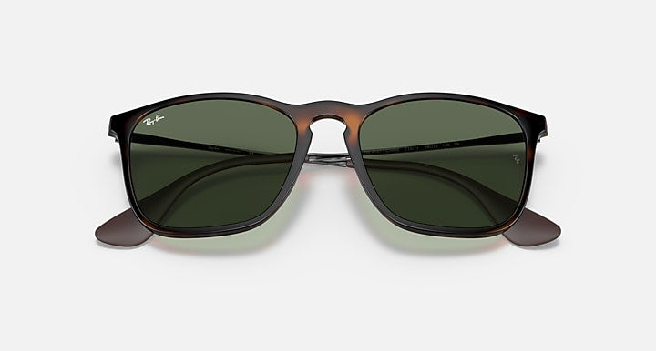 Close front view of green-lens sunglasses with dark Havana frame and low-profile bridge