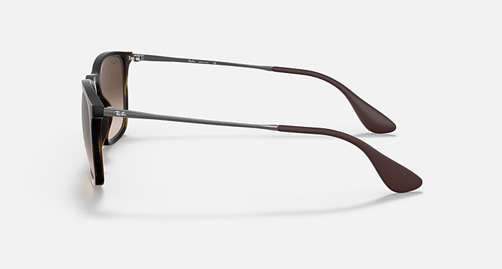 Side view of brown sunglasses with curved temples, metal hinge, and dark lens tint
