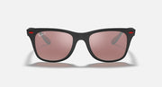 Black Ray-Ban sunglasses with pink lenses and red accents, straight-on view