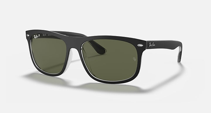 Black full-rim square sunglasses with green tinted lenses and Ray-Ban logo.