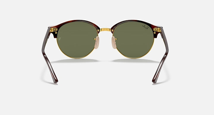 Front view of round sunglasses with green lenses, tortoise frame and gold-tone details