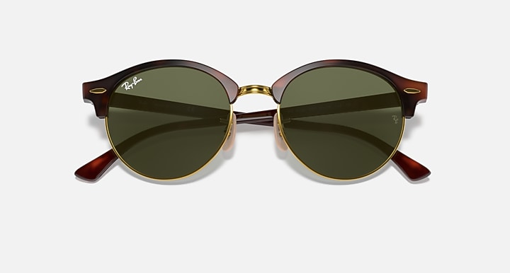 Round sunglasses with dark green lenses, tortoise brown frame and gold-tone nose bridge