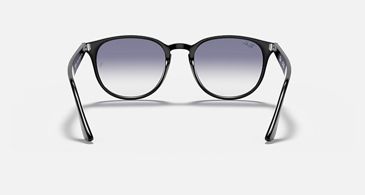 Black sunglasses with large round lenses and full frame, dark lens tint