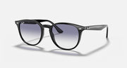 Black sunglasses with large round lenses, dark purple/blue gradient tint