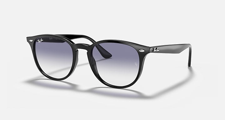 Black sunglasses with large round lenses, dark purple/blue gradient tint
