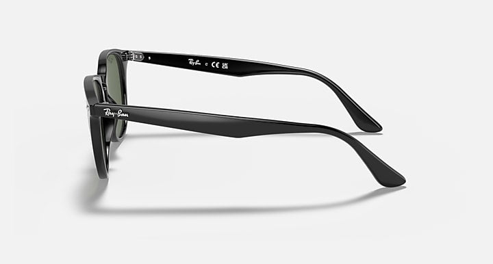 Ray-Ban RB4259F sunglasses, black frame with metal hinges and dark lenses, side view