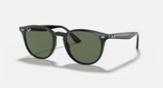 Ray-Ban RB4259F sunglasses with black frame and green-tinted lenses, large round shape