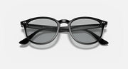 Black oversized round sunglasses with dark lenses and curved side arms