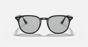 Black oversized round sunglasses with large lenses and dark gray tint