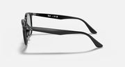 Black oversized round sunglasses, side profile with curved temples and gray lenses