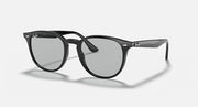 Black oversized round sunglasses with large lenses and smoky gray tint