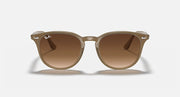 Light havana sunglasses with large round lenses, solid brown tint
