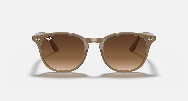 Light havana sunglasses with large round lenses, solid brown tint