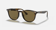 Ray-Ban RB4259F sunglasses with light havana frame and green-tinted lenses, large round shape