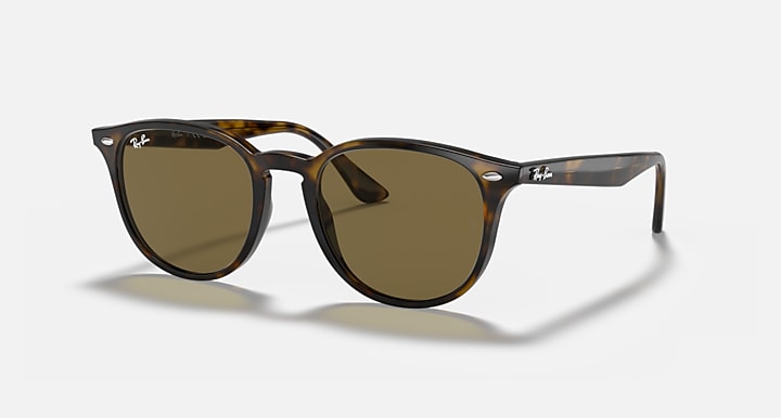 Ray-Ban RB4259F sunglasses with light havana frame and green-tinted lenses, large round shape