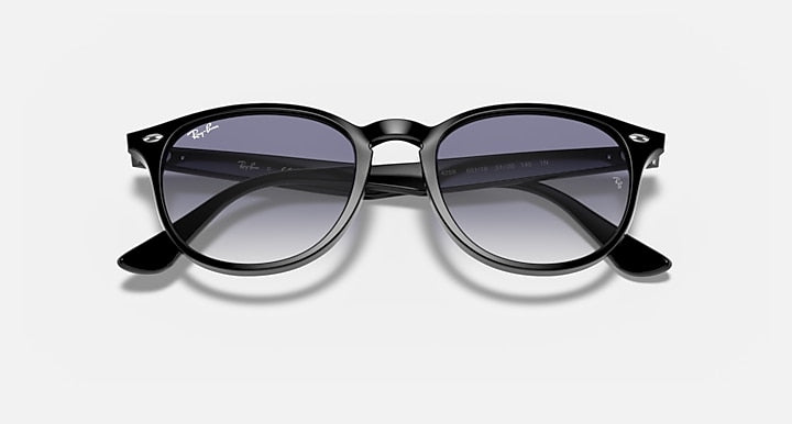 Ray-Ban RB4259 round sunglasses with black frame and purple tinted lenses, front close