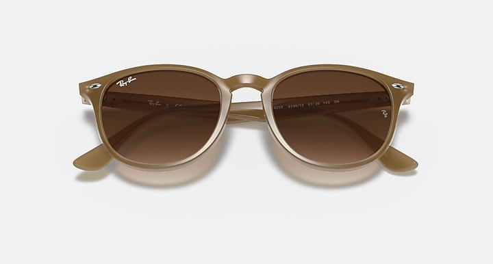 Ray-Ban RB4259 round sunglasses with light havana frame and brown tinted lenses