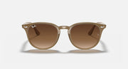 Ray-Ban RB4259 round sunglasses with light havana frame and dark brown lenses