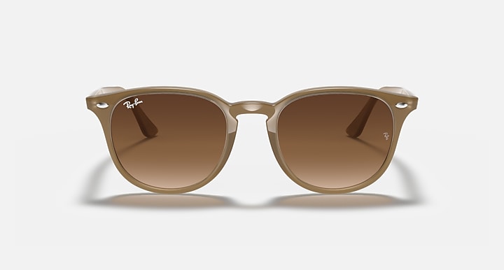 Ray-Ban RB4259 round sunglasses with light havana frame and dark brown lenses