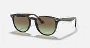 Ray-Ban RB4259 sunglasses with dark tortoiseshell frames and green-tinted lenses