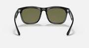 Black sunglasses with rounded rectangular frames and olive-tinted lenses