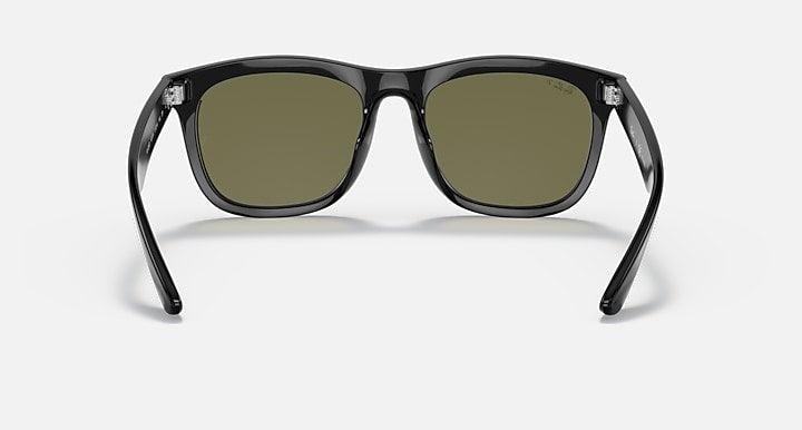 Black sunglasses with rounded rectangular frames and olive-tinted lenses