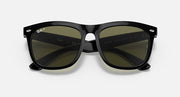Black sunglasses with olive tinted lenses and centered nose bridge
