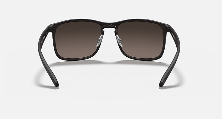 Sunglasses with black frame and brown mirrored rectangular lenses