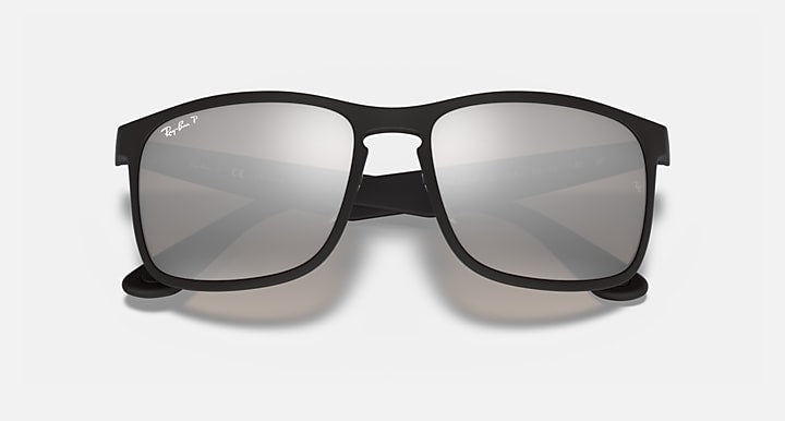 Sunglasses with black frame and gray mirrored rectangular lenses