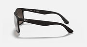 Matte black sunglasses with tinted lenses, side view, and Ray-Ban logo