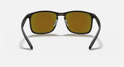 Black rectangular sunglasses with gold mirrored lenses and Ray-Ban logo