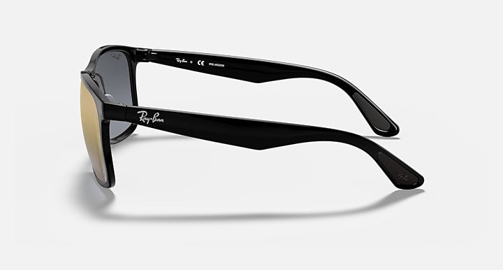 Ray-Ban side view sunglasses with black frame and gold mirrored lenses