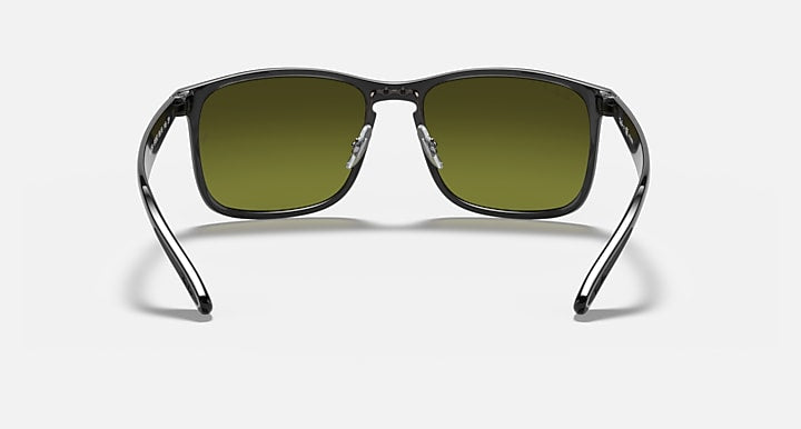 Sunglasses with black frame and green mirrored rectangular lenses