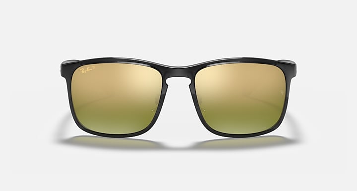 Black square sunglasses with warm gold mirrored lenses and Ray-Ban logo