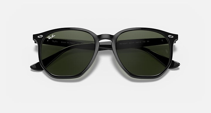 Ray-Ban hexagonal sunglasses with black frame and dark green lenses, top view