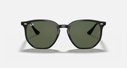 Ray-Ban hexagonal sunglasses with matte dark frames and green tinted lenses, front view