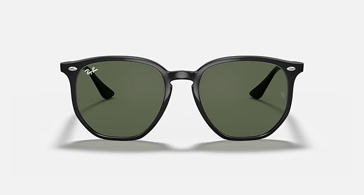 Ray-Ban hexagonal sunglasses with matte dark frames and green tinted lenses, front view