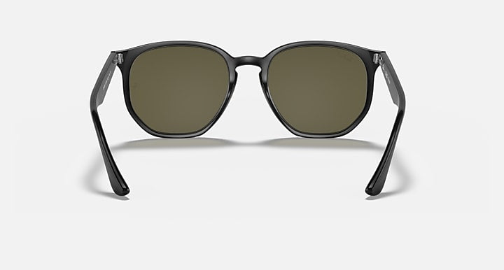 Clear black hexagonal sunglasses with olive green tinted lenses, front view