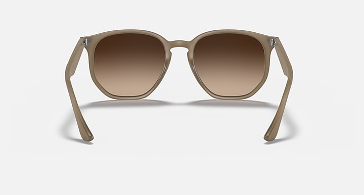 Tan hexagonal sunglasses with brown tinted lenses and full front view