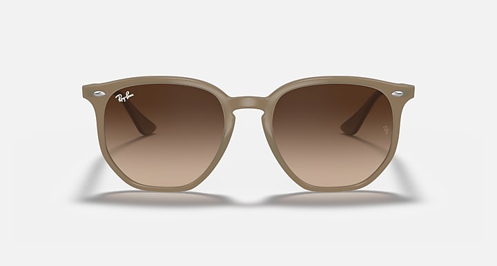 Tan hexagonal sunglasses with gradient brown lenses and thin side arms