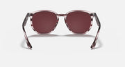 Hexagonal sunglasses front view with burgundy striped frame and dark maroon lenses