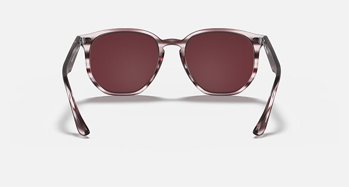 Hexagonal sunglasses front view with burgundy striped frame and dark maroon lenses