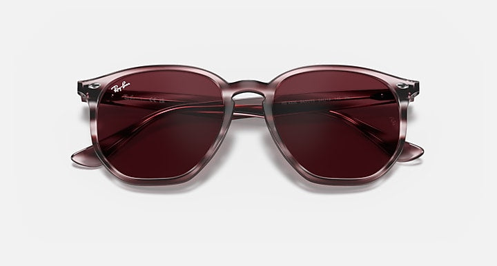 Hexagonal sunglasses front view with burgundy frame and dark maroon lenses