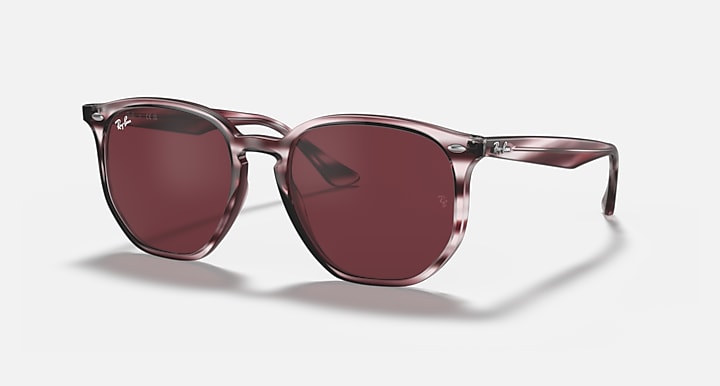 Hexagonal sunglasses with burgundy frame and dark maroon lenses