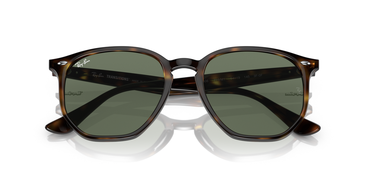 Ray-Ban hexagonal sunglasses with dark tinted lenses and brown tortoise frame